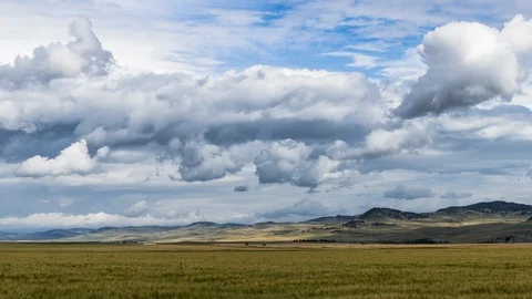 Storm clouds above farm field 8K timelapse Stock Footage 117942376