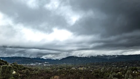 Storm Clouds above Mountain Town in California's Sierra Nevada Stock Footage 282473840