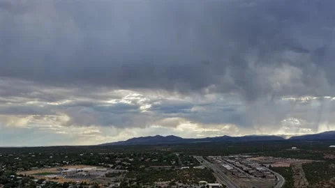 Storm Clouds And Light Rays Over White Rock Stock Footage 345155214
