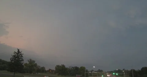 Storm Clouds and Lightning over Intersection - Stop Light Stock Footage 80210041