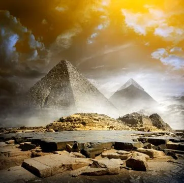 Storm clouds and pyramids Stock Photos