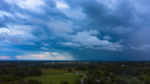 Storm Clouds and Rain Approaching from Distance - 4K Aerial Hyperlapse Stock Footage 94642735
