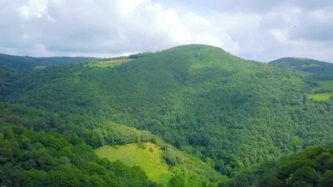 Storm clouds and sun over a mountain of caurel, lugo Stock Footage 168415842