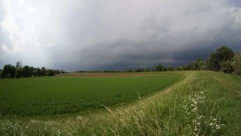 Storm Clouds and Sun Rays Over Countryside Landscape Timelapse 스톡 동영상 336694930