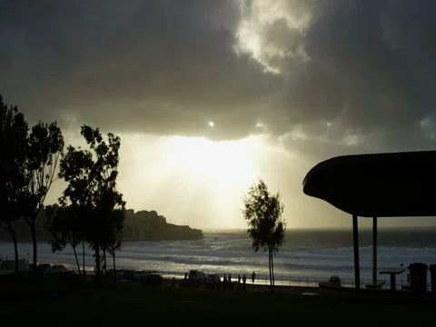 Storm clouds and sunrays over Bondi Beach at sunrise, timelapse Stock Footage 85251960
