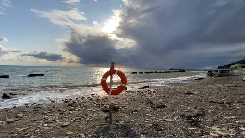 Storm clouds and wave on the beach Stock Footage 117482878
