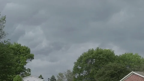 Storm clouds approach time lapse with trees blowing 動画素材 76330330