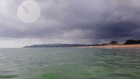 Storm Clouds Approaching Coastline Seen From Sea With Rain Columns Vídeo Stock 331153592