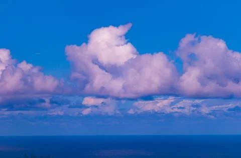 The storm clouds are approach over the blue sky Stock Photos