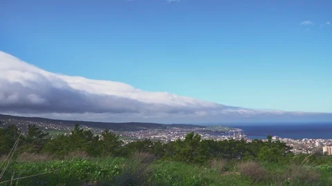Storm clouds around the city over the sea Stock Footage 107346323