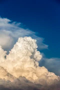 Storm clouds bathed in sunset light Stock Photos