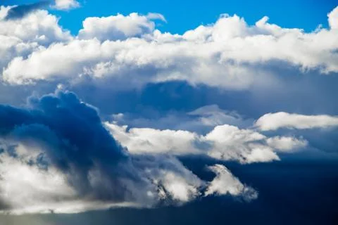 Storm clouds on a blue sky. Background for design. Stock Photos