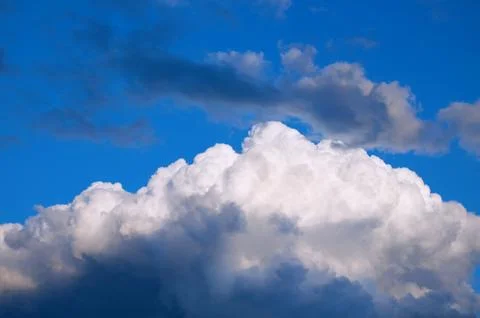 Storm clouds in the blue sky. Stock Photos