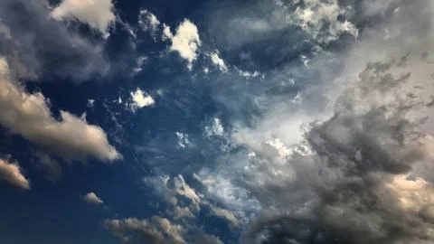 Storm clouds in the blue sky Stock Photos