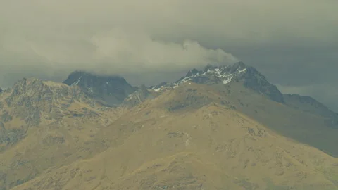 Storm clouds brewing above rocky mountain Stock Footage 159750004