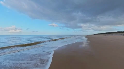 Storm clouds build over the North Norfolk coast Video stock 254982009