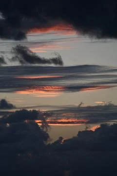 Storm clouds changing colour at dawn Stock Photos
