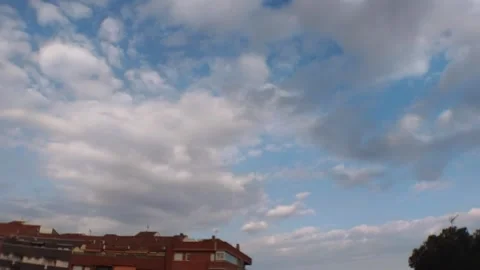 Storm Clouds Clearing to Blue Sky Over City Building Timelapse Video stock 331318449