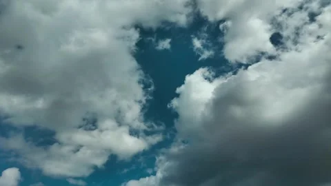 Storm clouds clearing to blue sky Stock Footage 341772522