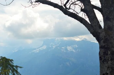 Storm clouds covering a mountain range. Stock Photos