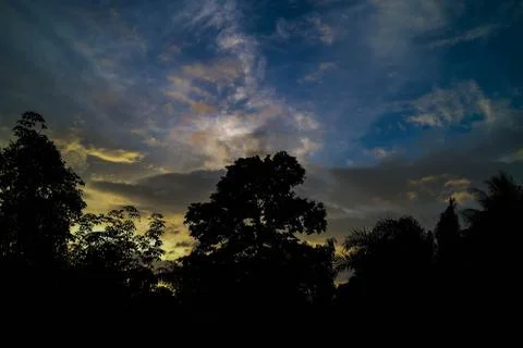 Storm clouds evening light orange background. Foto stock