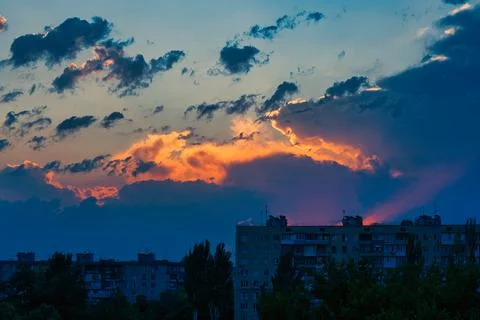 Storm clouds float across the blue sky Stock Photos