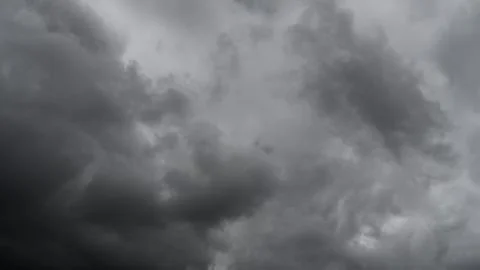 Storm clouds float across the sky Stock Photos