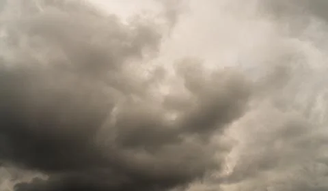 Storm clouds float across the sky Stock Photos