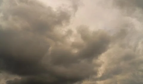 Storm clouds float across the sky Stock Photos