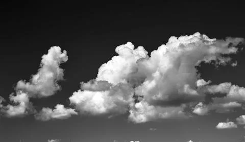 Storm clouds floating across the blue sky Stock Photos