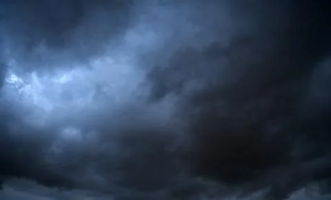 Storm clouds floating in a rainy day with natural light. Cloudscape scenery.. Stock Photos