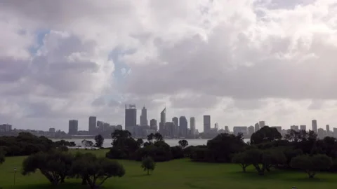 Storm clouds fly above Perth City, viewed across Swan River. Time lapse Video stock 134375539
