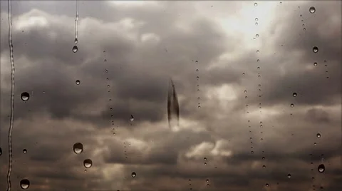 Storm clouds flying fast through the rainy window, close up view Video stock 64229891