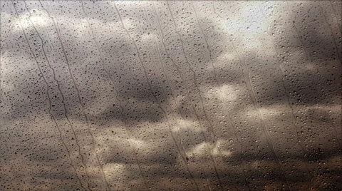 Storm clouds flying fast through the rainy window, wide angle view Stock Footage 64229950