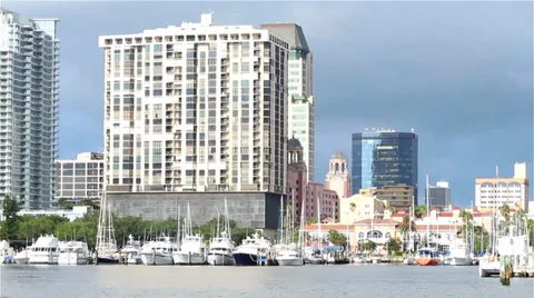 Storm clouds form over downtown city by the water Stock Footage 31585082