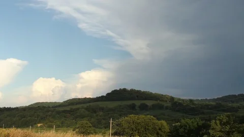 Storm Clouds Forms over Hilly Forest Sunset Stock Footage 81797862