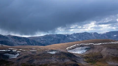 Storm clouds gather over the bear tooth Mountains section of Montana just north Stock Photos
