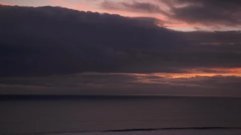 Storm clouds gather over a dark ocean 스톡 동영상 102865926