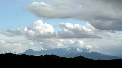 Storm clouds gather over Goblin Valley State Park, amidst flashes of sunlight. Video stock 11520674