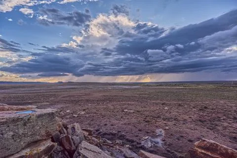 Storm clouds gather over the vast landscape of Petrified Forest National Park Stock Photos