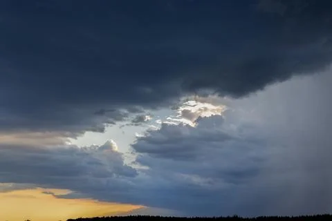 Storm clouds gathering with light breaking through Stock Photos