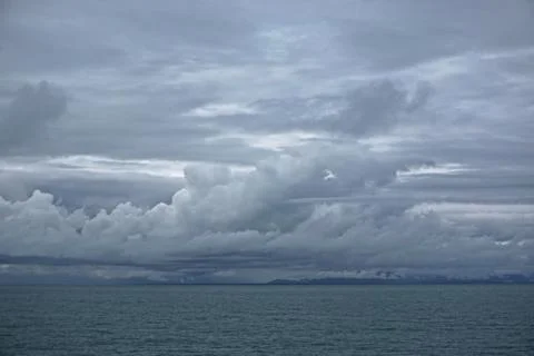 Storm clouds gathering over the deep blue waters of the Gulf of Alaska. Foto stock