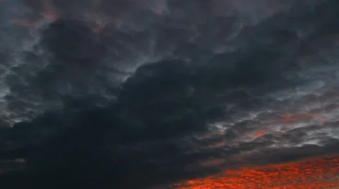 Storm clouds in the glow of the sunset Stock Footage 30301097