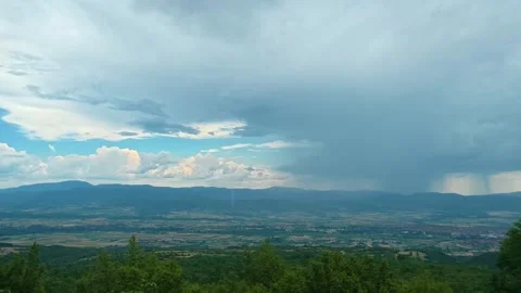 Storm clouds hover above distant hills. Pirot city, Serbia 스톡 동영상 341876648