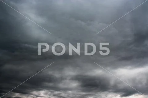 Storm clouds as if armageddon. Rainy clouds over horizon. Stock Photos