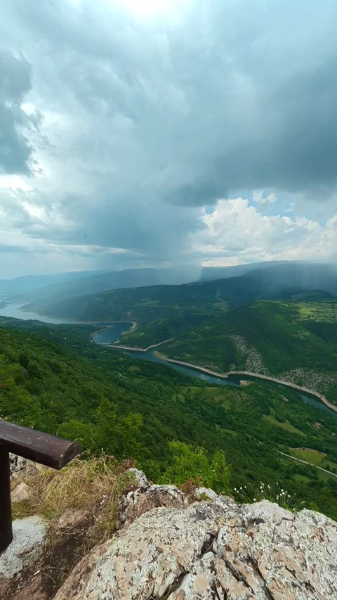 Storm clouds loom over rugged mountain peaks. Kozji Kamen viewpoint, Vertical 스톡 동영상 341882172