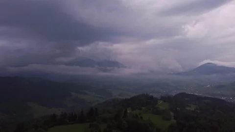Storm clouds in the mountain landscape. Lightning in the clouds. Thick fog Video stock 200815125