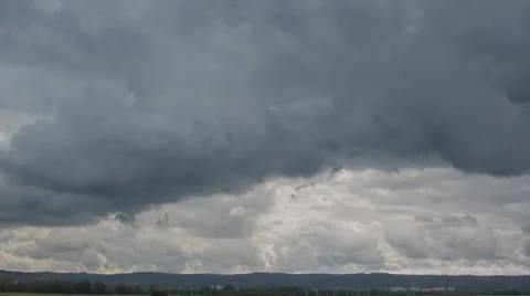 Storm clouds move on the sky cast the shadows. Stock Footage 62513898