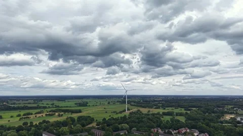Storm Clouds Moving Above Wind Turbine and Fields in Bremen, Germany Stock Footage 341696471