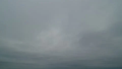 Storm clouds moving across dark gray sky background. Time lapse. Stock Footage 190303427